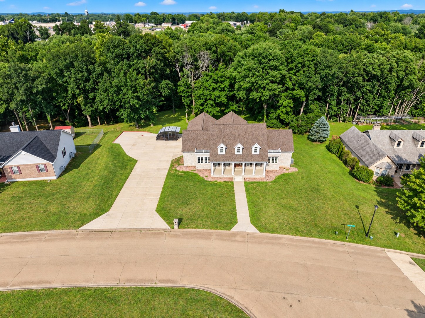 Aerial of large brick and stone estate home - HelixMind Real Estate Media