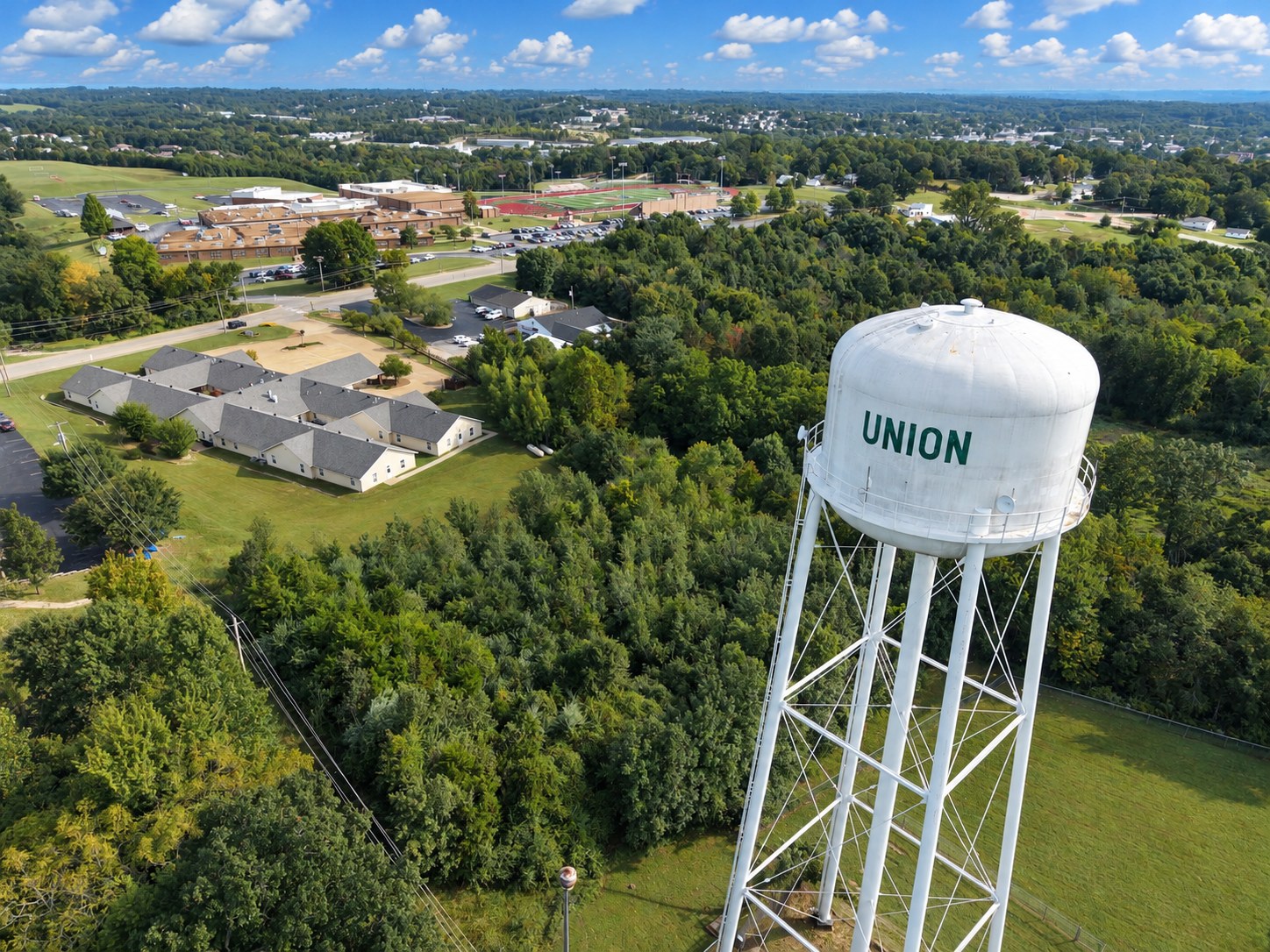 Aerial of Union water tower overlooking school and neighborhood - HelixMind Real Estate Media