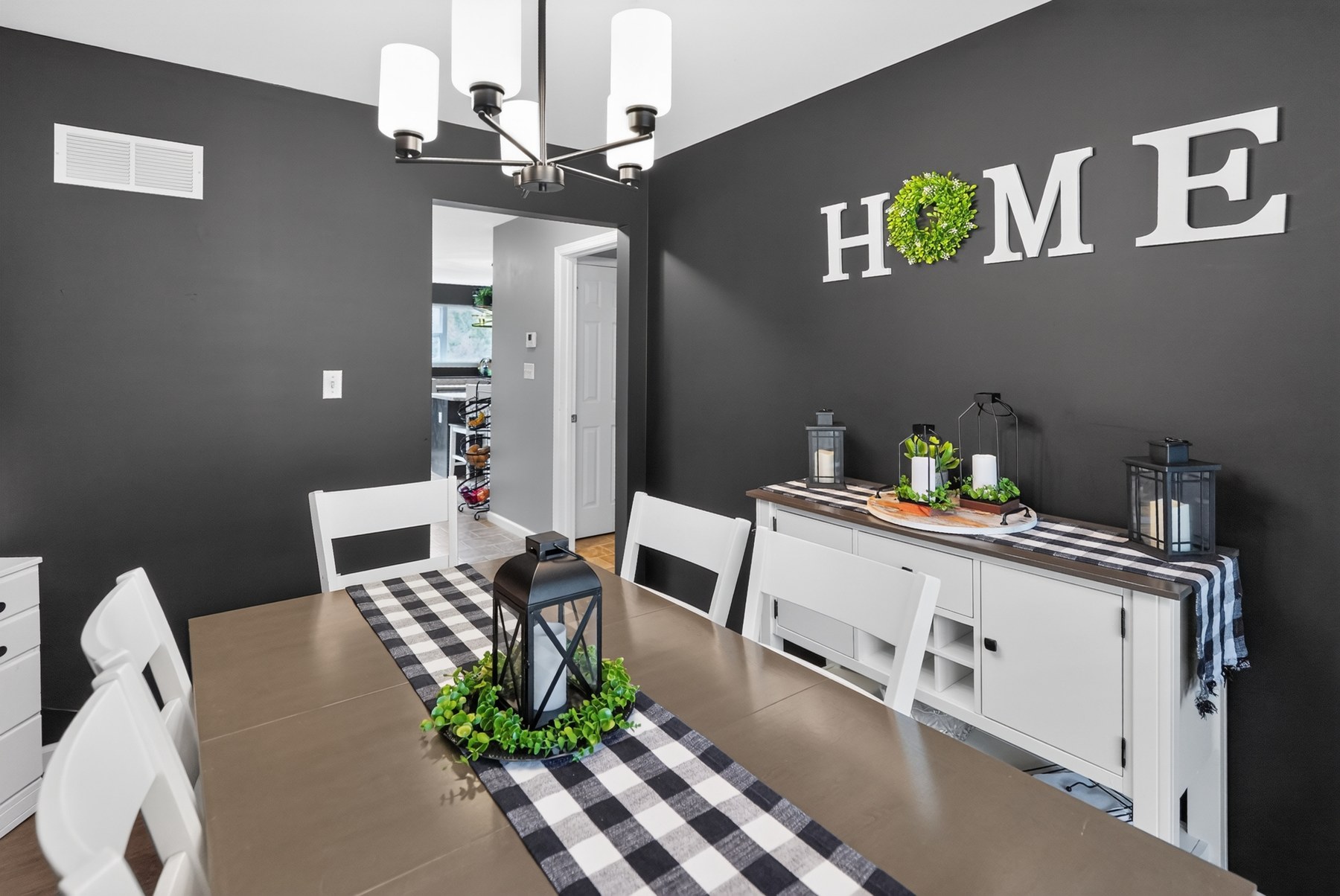 Styled dining room with dark accent wall · Southeast Missouri - HelixMind Real Estate Media