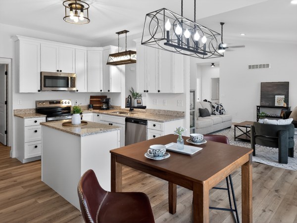 Furnished kitchen with island and dining nook · Southeast Missouri - HelixMind Real Estate Media