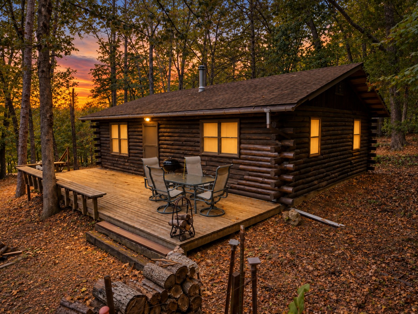 Secluded log cabin with deck in autumn woods at sunset - HelixMind Real Estate Media